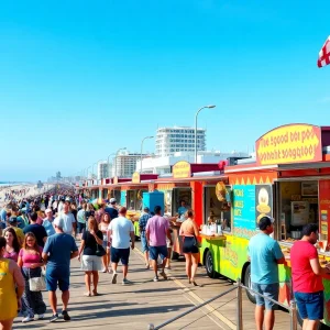Colorful food trucks on a beachside boardwalk with crowds enjoying food in Virginia Beach
