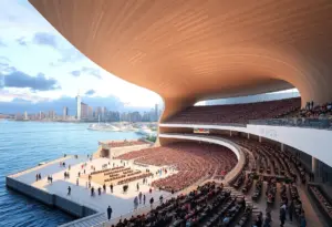 Illustration of a large indoor arena near the beach with surrounding urban infrastructure