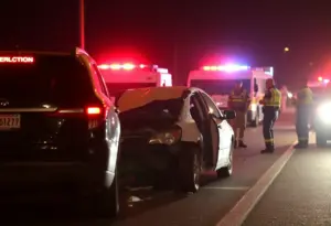 Vehicle crash scene with police lights